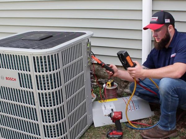 Denommee Plumbing, HVAC & Electric team and work vehicle in Tyngsborough
